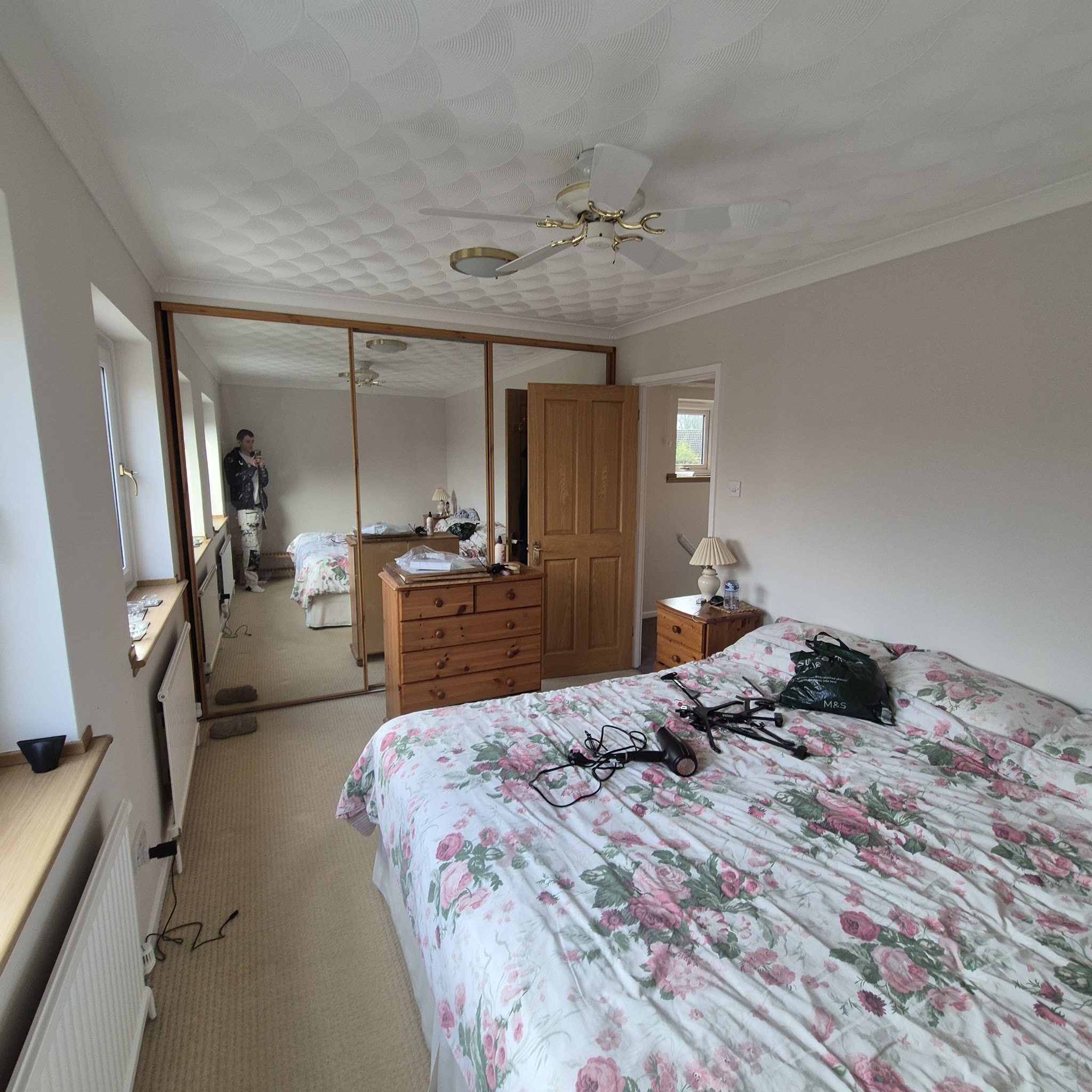 Freshly decorated bedroom with fitted mirrored wardrobes